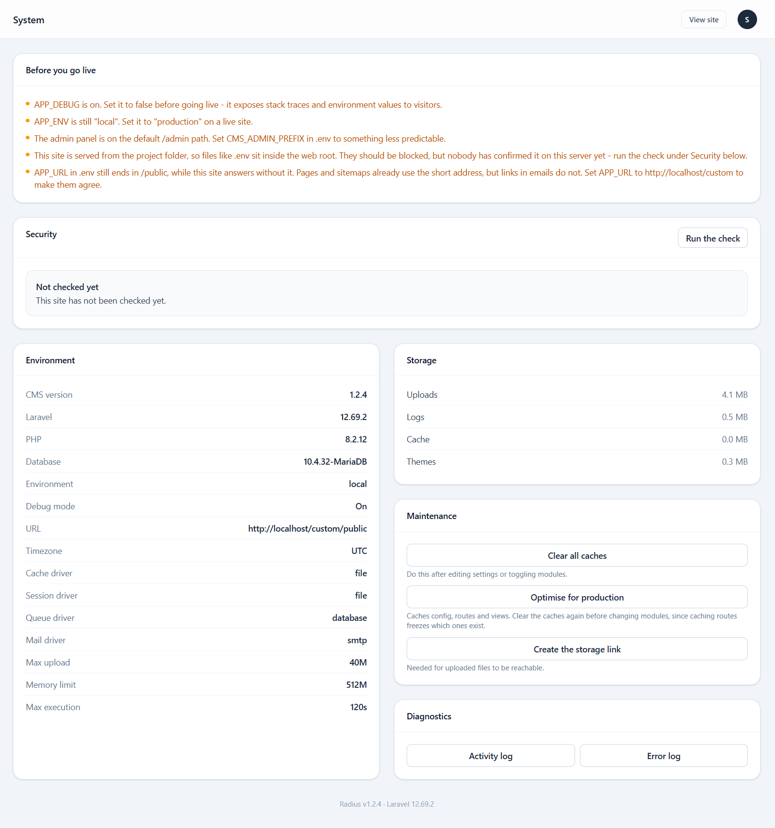 The System screen showing environment details, PHP extension checks, writable path checks and a configuration warning list
